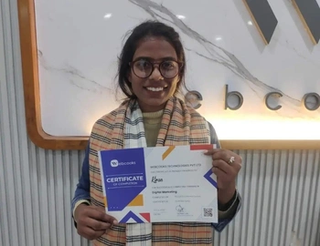 Kiran  proudly receiving a Digital Marketing certificate from webcooks
