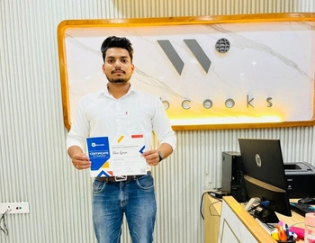 Priya being certified from the webcooks after completing a web designing course