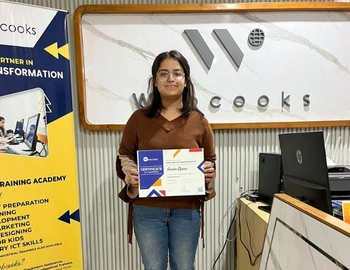 The Director of WebCooks giving a certificate of Digital Marketing course to Priya. 