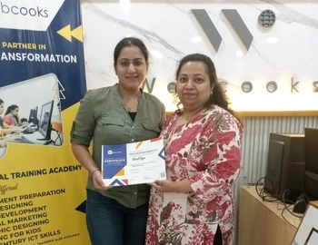 A student receives their Digital Marketing course certification from Webcooks.