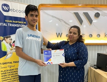 A student receiving a certificate after completing the course from the Webcooks.
